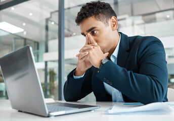 Canvas Print - Businessman, laptop and working with thinking, stress and mental health at deadline or job. Male person, frustrated and planning with tech in office for project, internet and online as market analyst