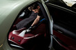 © Rabizo Anatolii - Hoovering car backseat with vacuum extractor. Detailing auto seats with special hoover nozzle.