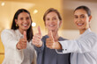 © peopleimages.com - Thumbs up, group or business women with support, excellence or thank you in office closeup. Like, hand gesture or sign for teamwork, success or emoji for good job after winning with smile in portrait