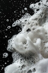 Poster - Foamy water on a black surface, a small-scale representation of ocean waves