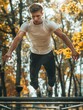 Man is doing handstand on metal bar