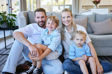 Canvas Print - Portrait, happy family and kids with parents in home on floor for love, care or bonding together. Dad, mom and smile of children in living room for relax, connection and support with young siblings