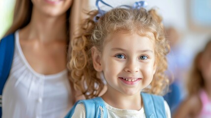 Sticker - A young girl with curly hair is smiling and wearing a blue shirt