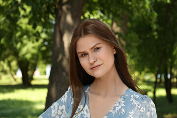 Canvas Print - Portrait of beautiful woman in summer park