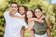 © Lumeez23/peopleimages.com - Family, portrait and kids with piggyback in park for outdoor adventure, support and vacation. Happy, woman and man with daughter in nature for summer holiday, break and weekend trip in Costa Rica