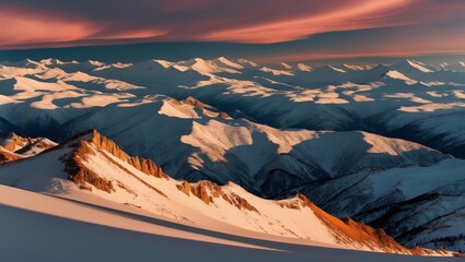 Wall Mural - Mountain peaks covered in snow bathed in the soft glow of sunrise