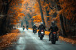 © KirKam - A group of motorcyclists riding through a scenic autumn forest with vibrant orange and yellow foliage, capturing the camaraderie and adventure of a fall motorcycle tour.