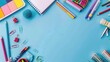 © AkuAku - School supplies with blue background top view copy space