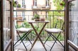 © Amni - Balcony Terrace with Wooden Table and Chairs