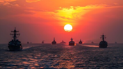 Wall Mural - Naval Fleet Silhouetted Against a Fiery Sunset