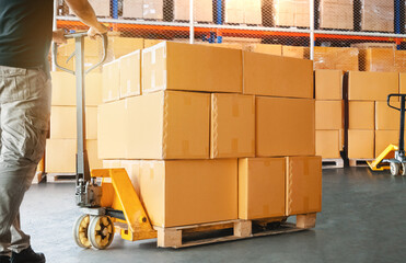 Wall Mural - Workers Loading a Package Boxes in Warehouse. Cartons, Cardboard Boxes. Storage Warehouse. Supply Chain, Supplies Goods Shipment. Warehouse Shipping Logistics.