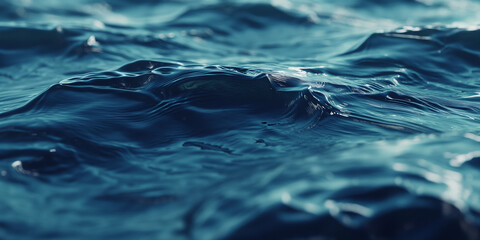 Wall Mural - A close up of the water surface, showing ripples and waves on a deep blue sea