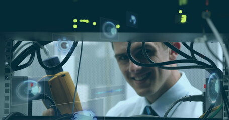 Poster - Image of round scanners and data processing over caucasian male engineer working at server room