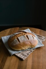 Wall Mural - fresh bread on napkin and on a table