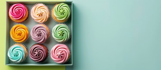 Poster - Colorful background enhances the appeal of the box with delicious cupcakes, ideal for showcasing in a copy space image.