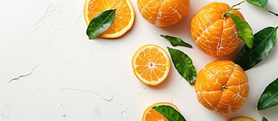 Poster - Close-up photo of fresh citrus fruits such as orange mandarins, tangerine peel, or mandarin slices on a white background with copy space image.