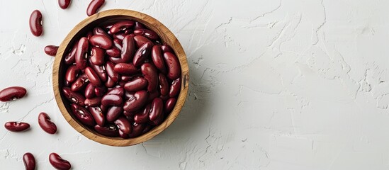 Poster - Wooden bowl filled with red canned beans on a white background, providing ample copy space image.