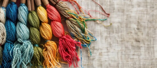 Poster - Embroidery kit with colorful threads and canvas background for stitching, with room for a copy space image.