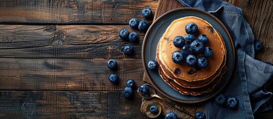 Aufkleber - Breakfast featuring pancakes and blueberries set on a dark wooden table with available copy space image.