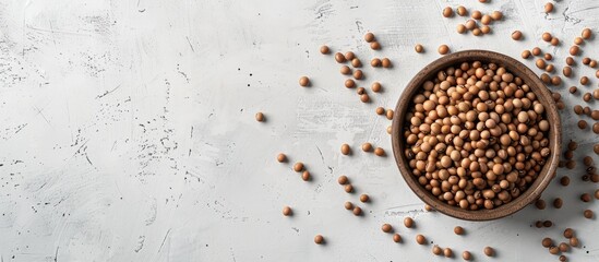 Canvas Print - Healthy concept with soybeans in a bowl on a white table background, providing copy space image.