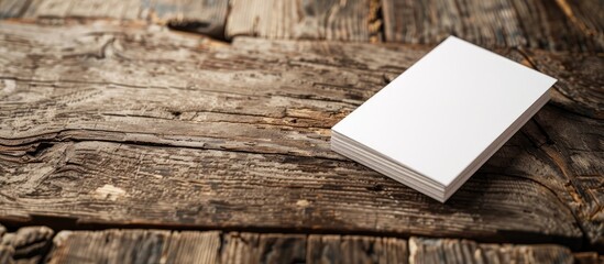Aufkleber - A business card lies on a wooden surface for a corporate stationery mock-up in a designer's creative workspace, with ample copy space for an image.
