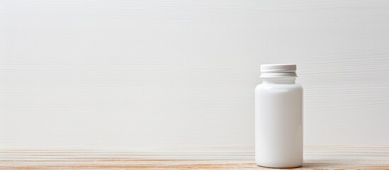 Aufkleber - White wooden background displaying a pill bottle with copy space image.