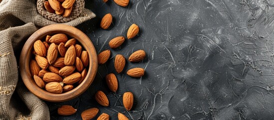 Poster - Almond nut and milk neatly arranged on a table with plenty of copy space image.