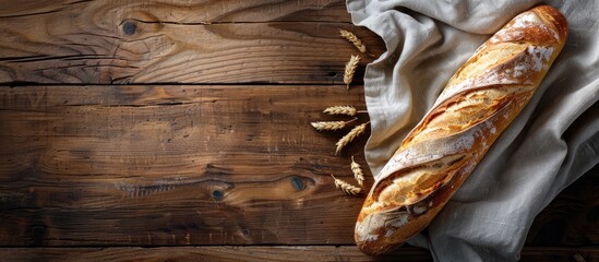 Poster - Bakery-fresh baguette on a wooden backdrop with copy space image.