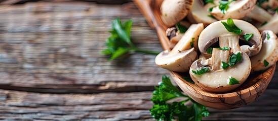 Poster - Wooden spoon holding fresh champignon slices with parsley, perfect for cooking delightful dishes with white mushrooms. Ideal for a copy space image.