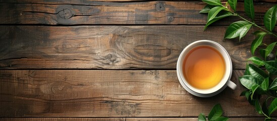 Poster - Wooden table hosts a cup of fragrant green tea with ample copy space image.