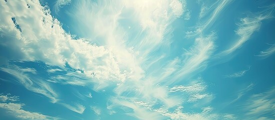 Poster - A serene cloudscape with white wispy clouds against a blue sky, ideal as a background image for design projects with copy space. Conveys a sense of hope and peace, evoking a celestial theme.