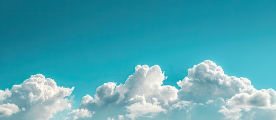 Canvas Print - Clear blue sky with white clouds adds beauty to a copy space image