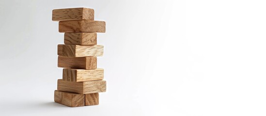 Poster - Wooden block tower game with a white backdrop features ample copy space image