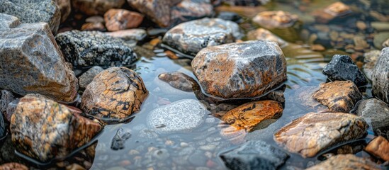Poster - Rocks made of granite scattered in the water creating a picturesque scene with copy space image