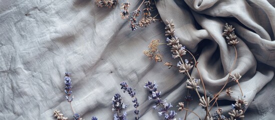 Poster - Mockup of a card with grey linen fabric adorned by dried lavender and eucalyptus flowers offering a pleasant copy space image