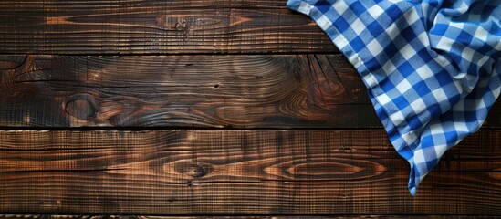Aufkleber - Aerial view of a dark wooden table adorned with a blue checkered tablecloth featuring ample copy space for customization