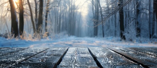 Poster - Blur winter forest background with empty wooden surface perfect for copy space image