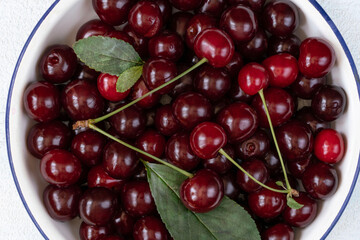 ripe red sour cherry fruits with leaves