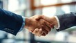 © Penatic Studio - Businessmen shaking hands in a successful partnership agreement on blur office background.