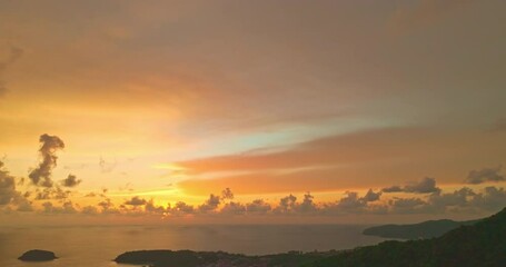 Wall Mural - Aerial view A dramatic day filled with colorful clouds floats above the sea on a clear day with a colorful sky. Scene of sweet yellow light in the sky background.