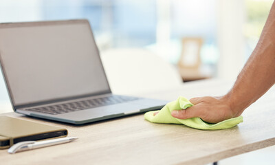 Poster - Man, laptop and hand cleaning desk for hygiene, bacteria and dirt or dust in modern office. Employee, computer and wiping table with cloth for disinfection, healthcare and safety from germ risk