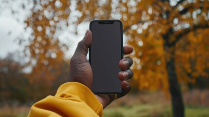 Aufkleber - A person holding a cell phone in their hand