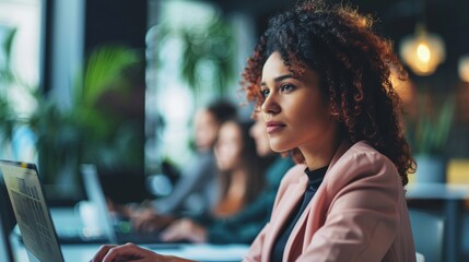 Poster - Having a conversation with a businesswoman on our laptop, planning and strategy in the office, and working on a teamwork project with a diverse team.