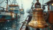 © Maximages  - A close-up view of a rusty ship's bell on a deck with several boats moored in the background under a cloudy sky. The picture evokes a sense of maritime history and nostalgia.