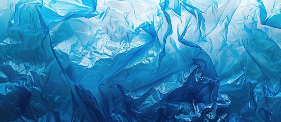 Fototapete - Reuse a clear blue plastic bag to create an eco friendly abstract texture image and help protect the environment. copy space available