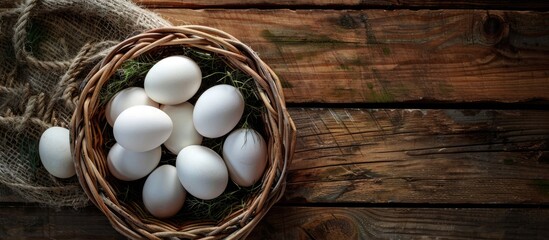 Poster - Eggs in a basket with a background perfect for adding your own content creating a copy space image