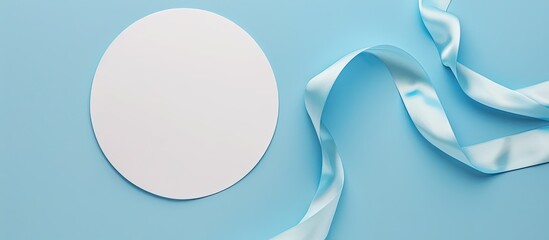Aufkleber - An overhead perspective of a vacant white circle adorned with a soft blue ribbon on a bright isolated backdrop perfect for adding text or images. copy space available