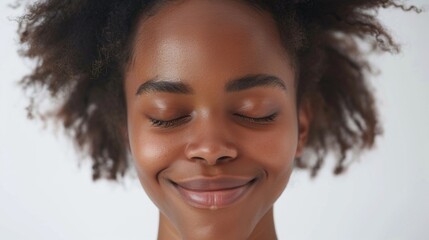 Wall Mural - A close-up shot of a woman with her eyes closed, possibly in a state of meditation or deep thought