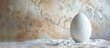 © Gular - A white plaster covered decorative egg featuring copy space image