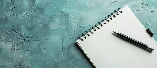 Aufkleber - Notepad and pen on a blank backdrop with ample copy space image